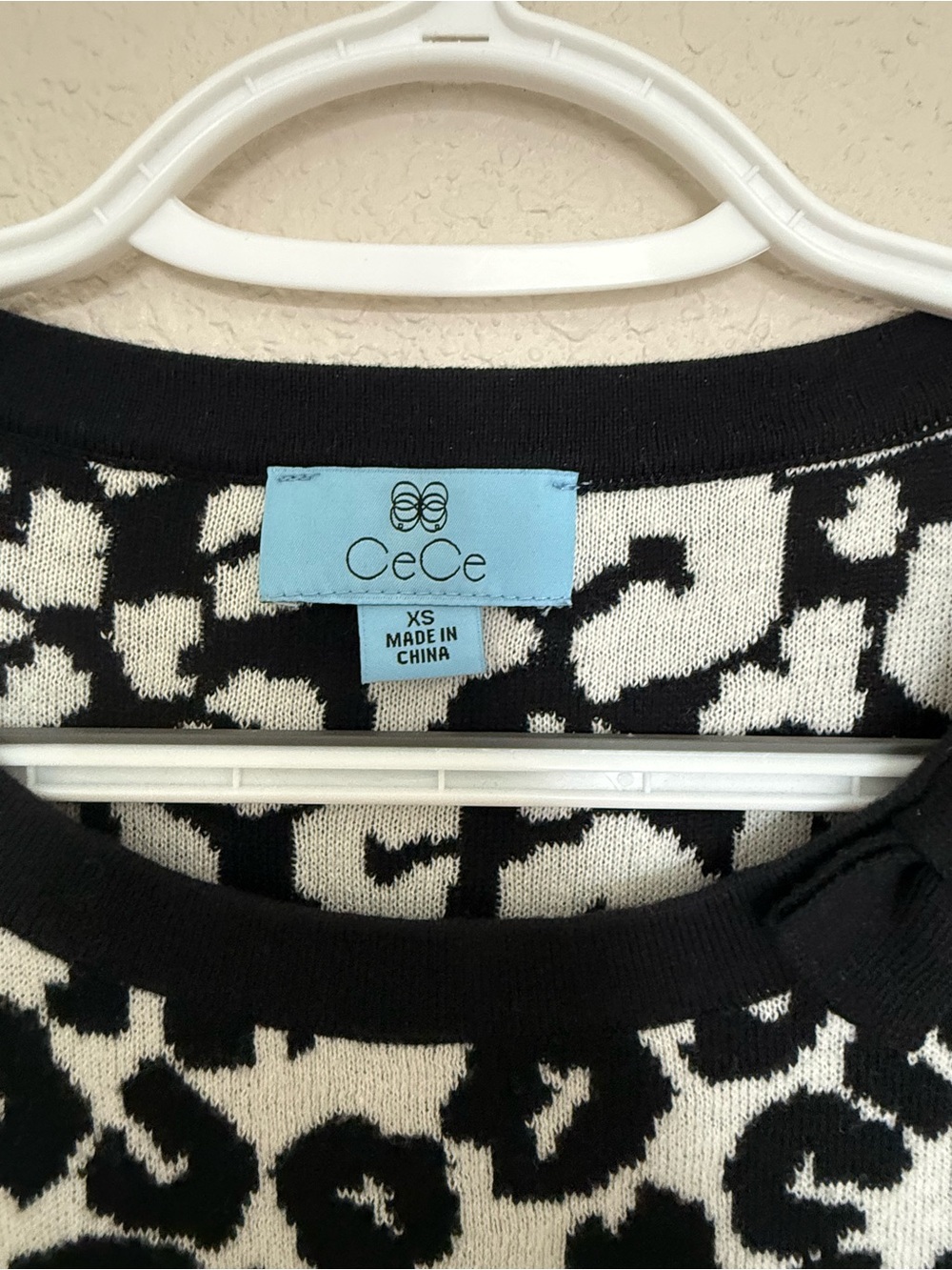 CeCe Black and White Leopard-Print Crewneck Sweater